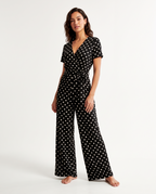 Women's Black Polka Dot V-Neck Wide Leg Jumpsuit - Short Sleeve – model view